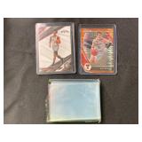 2 basketball cards and sleeves