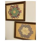 Two framed quilt pieces