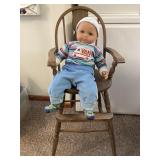 Childs chair with doll