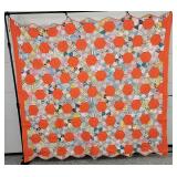 Orange Patchwork Quilt with Scalloped Edges