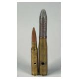 Pair of Holed Artillery Rounds