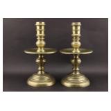 A Pair of Early Brass Boulette Candlesticks