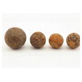 Four Excavated Iron Round Shot