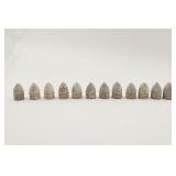 Thirteen Excavated Conical Lead Bullets