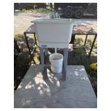 Shop sink set up for cleaning garden vegetables