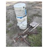 Shock wrench, shovel, pick ax and stack of