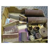 assorted sandpaper sheets wheels