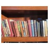 shelf of vintage kids hard cover books