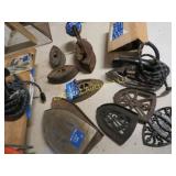 assorted sad irons w plates