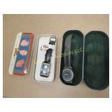 2 Fossil watches in tins