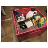 cleaning supplies in plastic crate