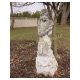 large concrete woman statue on base