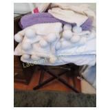 luggage rack stand blanket w pom poms pillows