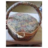 vintage sewing basket has in cushion on lid inside