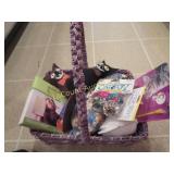 basket of cat toys groomin combs crinkle balls