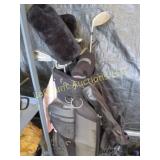 assorted golf clubs in bag Tommy Armour