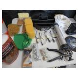 assorted shop items safety glasses caulk gun