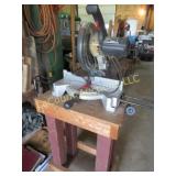 compound miter saw on wood table