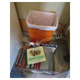 assorted tractor car books trash can