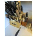 many assorted knives in wood blocks