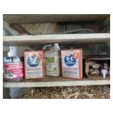 shelf of garage fluids degreaser adhesives