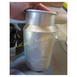 Milk pail 3//4 full of pennies