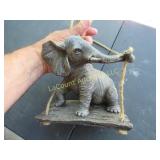 elephant on swing hanging garden decor
