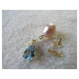 .6 grams 14K Hawaii charm a pearl & blue stone
