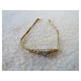 3.8 Gram 14K gold bracelet w blue stone