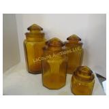 4 vintage LE Smith panel amber canisters