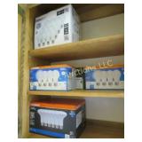 assorted light bulbs in cabinet