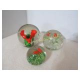 3 orange themed paper weights