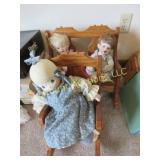 3 dolls on wood chair bench
