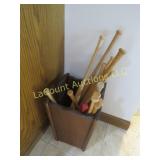 many mini baseball bats advertising in wood basket