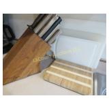 assorted kitchen knives cutting boards