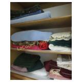 linens in top cabinet blankets table cloths more