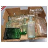 assorted bottles log cabin milk bottles