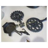 Griswold trivets ashtray & a vintage hat clip