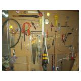 all hand tools level saw etc on wall