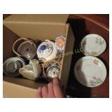 assorted teapots cups saucers