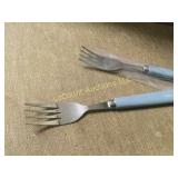 MANY blue handled metal forks never run out again!
