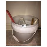 Plastic bucket with cleaners, brushes, vinegar