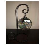 Glass ornament on stand