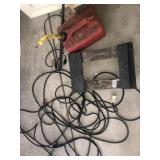 Extension cord, gas can, small furniture cart