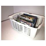 Small plastic basket with DVDs