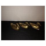 3 small brass ducks
