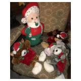 3 animal Christmas stockings and stuffed santa