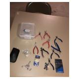 Assorted pliers and screw drivers and small tote