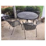 Wrought iron patio table and 4 chairs