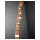 Set of 5 metal bells on leather strap